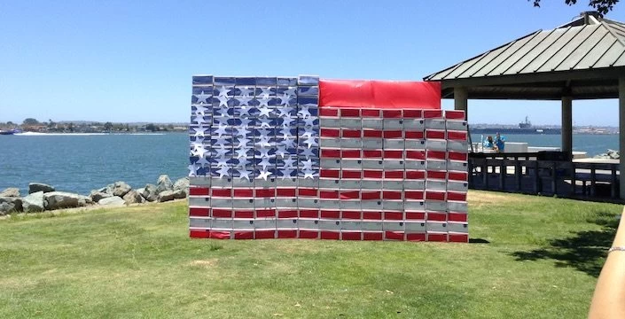 A person is taking a picture of an american flag.