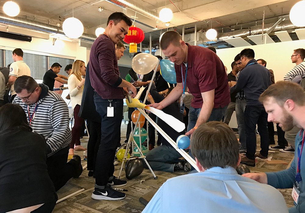 A group of people working on a project in an office.
