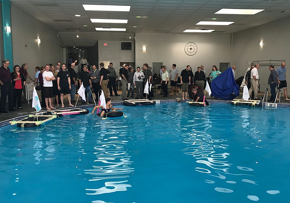 A group of people in a swimming pool.