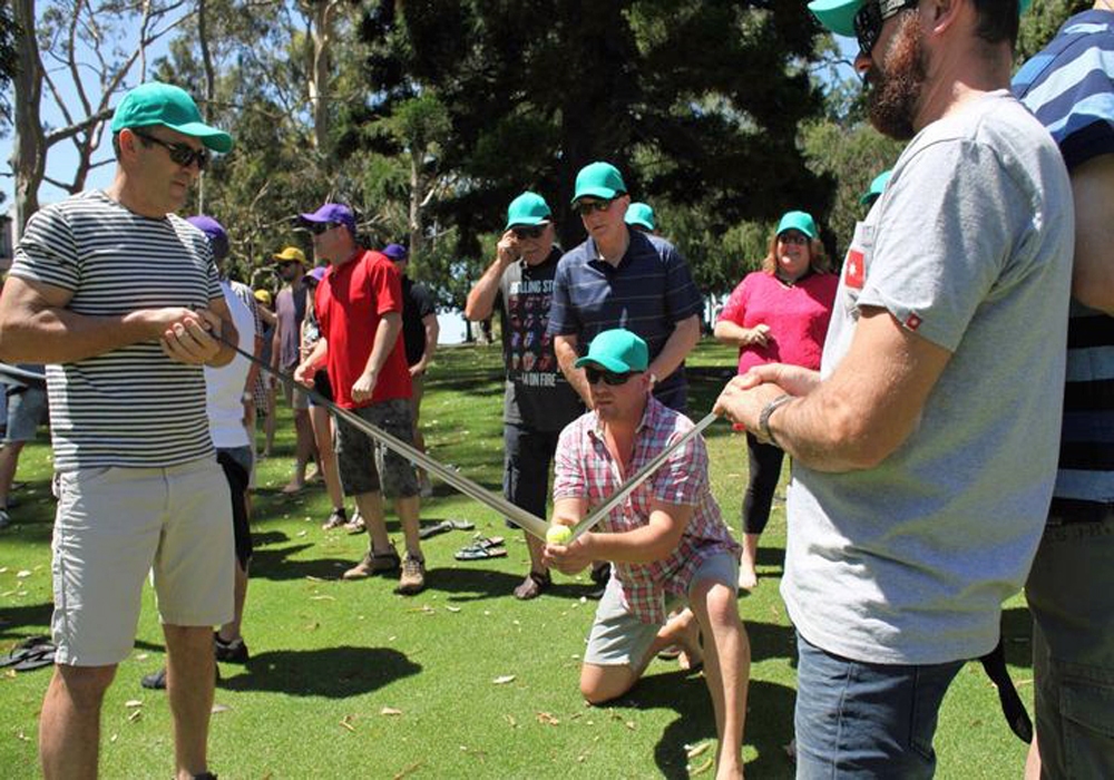 A group of people playing a game of golf.