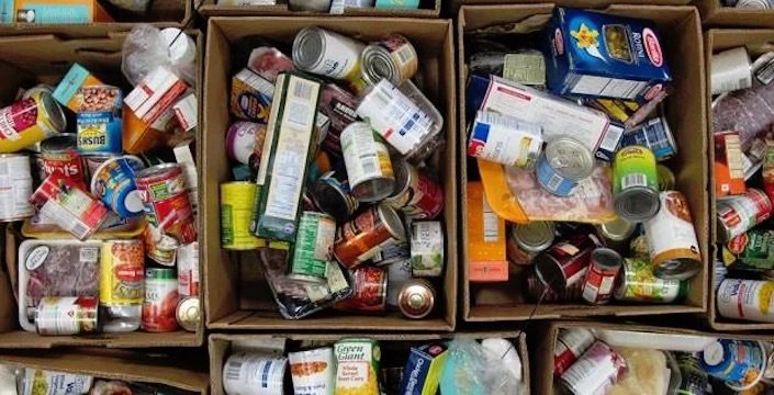 Many boxes of food are stacked on top of each other.