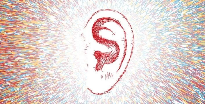 A red ear with a colorful background.