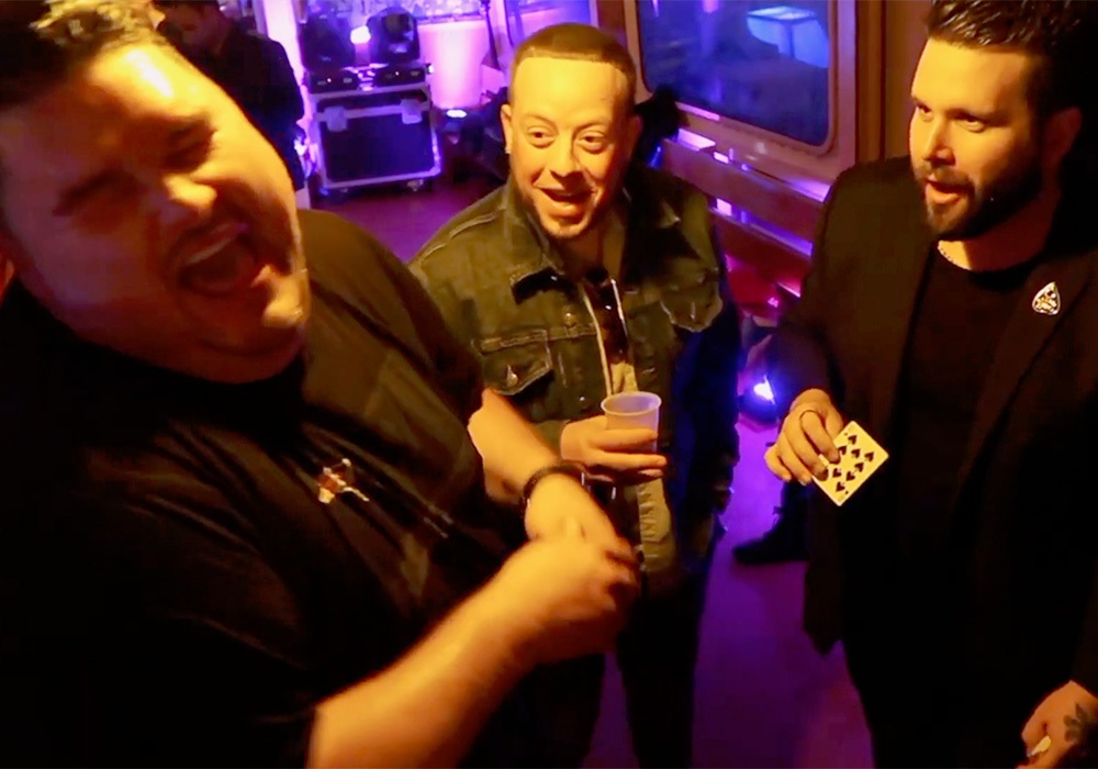 A group of men are laughing at a party.