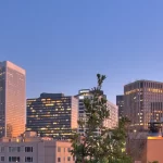 A view of a city skyline at dusk.