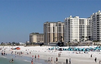 A beach with many people on it.