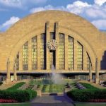 A large building with a fountain in front of it.