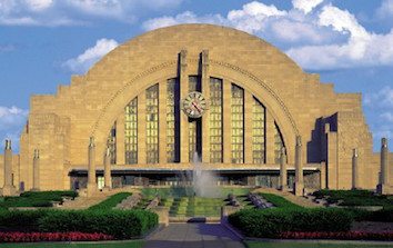 A large building with a fountain in front of it.