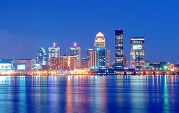 A city skyline reflected in a body of water.