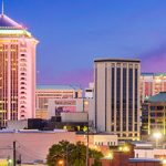 A city skyline at dusk.