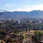 A view of the city of guadalajara with mountains in the background.