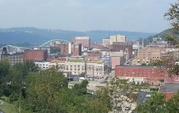 An awe-inspiring view of a city from the top of a hill, perfect for Wheeling corporate events.