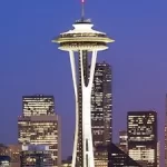 The space needle in Seattle is lit up at dusk and provides a fun atmosphere for corporate events.