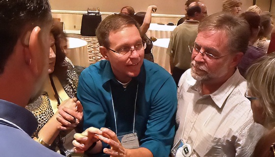 A man wearing a blue shirt.