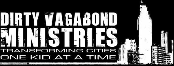 A black and white graphic with the words "Dirty Vagabond Ministries: Transforming Cities One Kid at a Time" and an urban skyline silhouette.