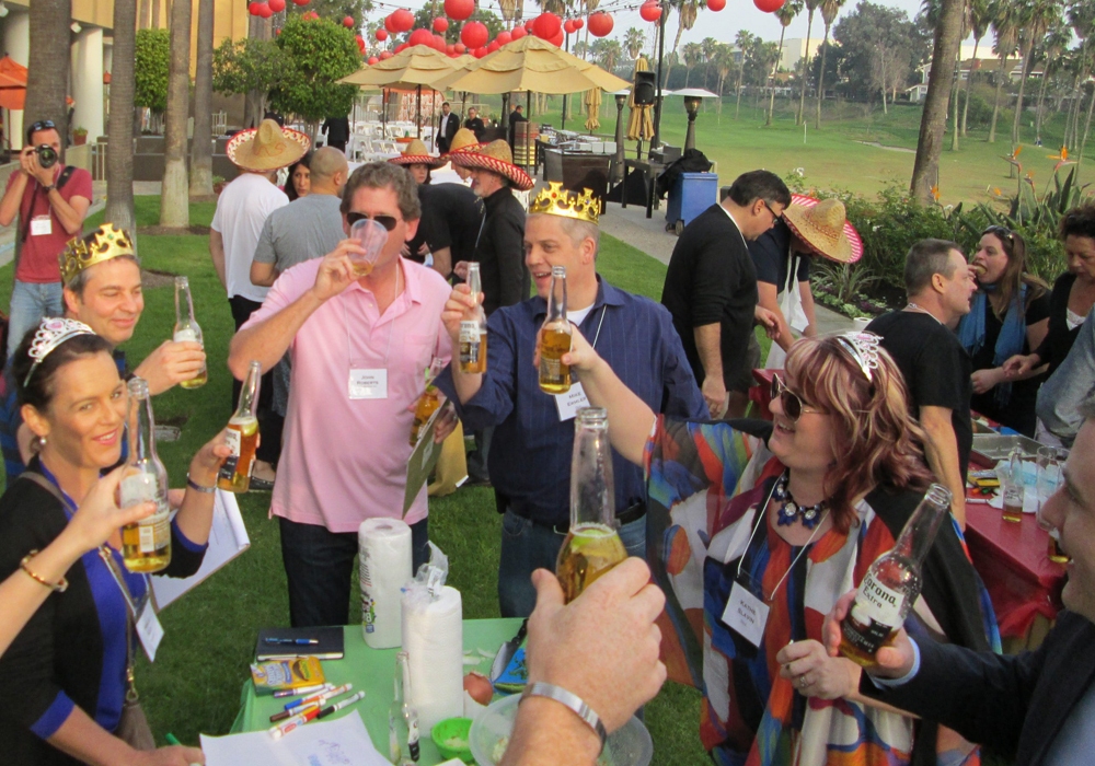 A group of people drinking beer at a party.