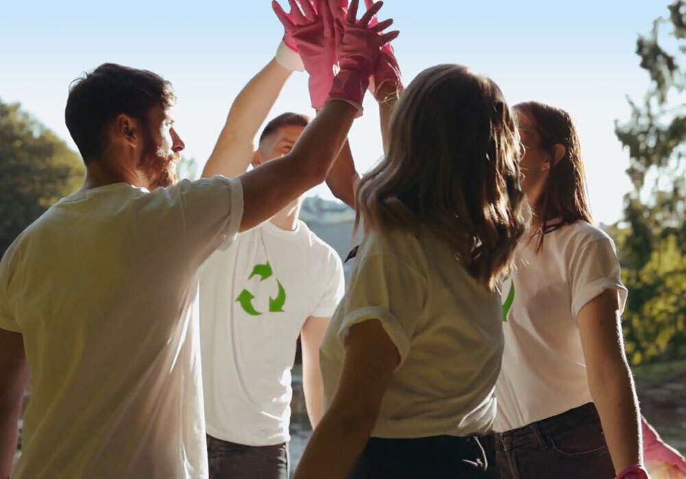 A group of people giving each other high fives.