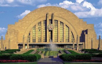 A large building with a fountain in front of it.