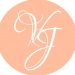 A peach circle with the letter vg on it.