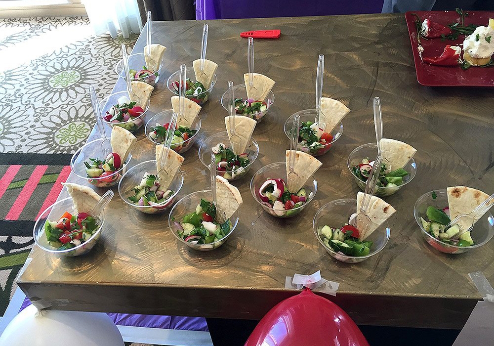 A table with a lot of food on it.