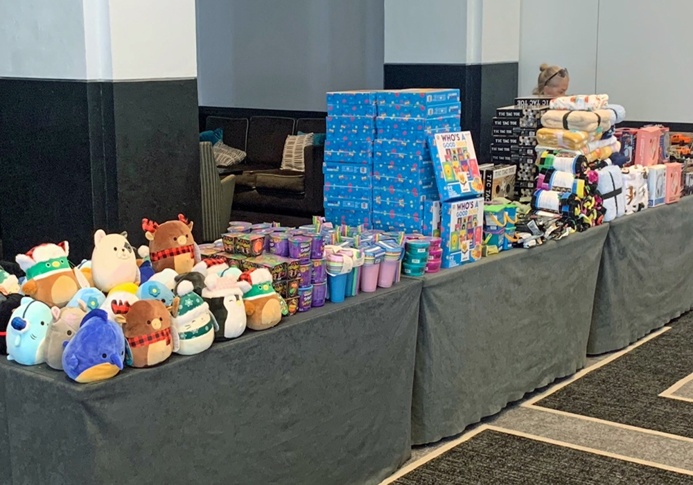 A display of stuffed animals on a table for a Toy Donation initiative.