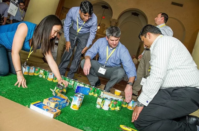 A group of people playing an indoor game.