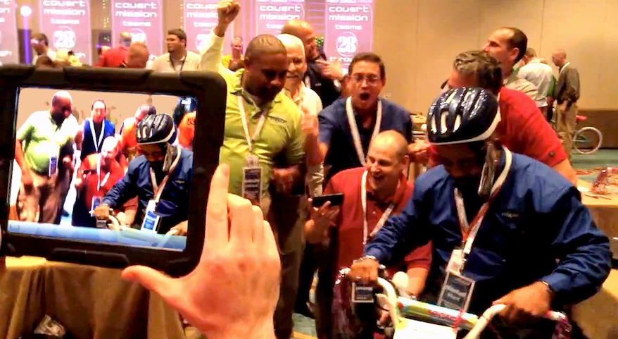 A team taking a picture with an ipad.