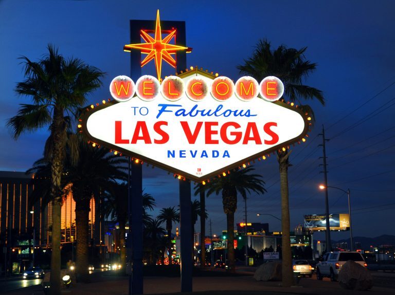 Las Vegas sign at night, illuminated by a charity bike build event.