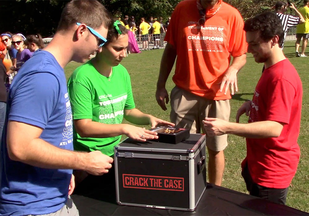 A group of people standing around a box.