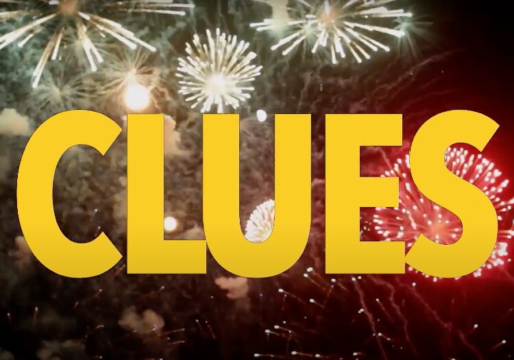 The word clues with fireworks in the background.