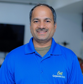 A man in a blue shirt.