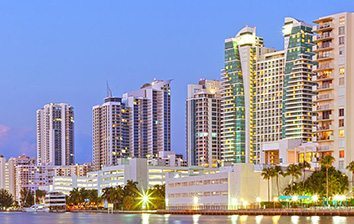 A view of the miami skyline at dusk.