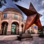 A statue of a star in front of a building.