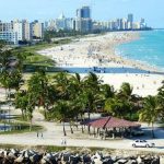An aerial view of a beach and city.
