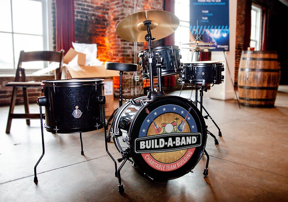 A drum set is sitting on a table in a room.