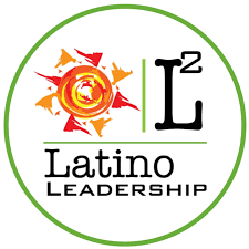 Logo of Latino Leadership featuring a sun design on the left and the text "L2 Latino Leadership" on the right, encircled by a green border.