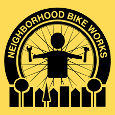 Logo for Neighborhood Bike Works in black and yellow. It features a figure holding a wrench and hammer inside a wheel, above a cityscape silhouette.
