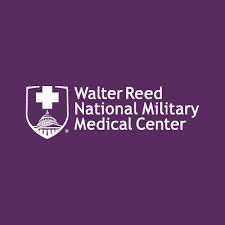 Logo of Walter Reed National Military Medical Center on a purple background, featuring a white shield with a cross and the building's dome.