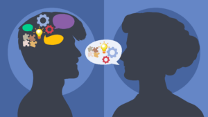 Two silhouetted heads face each other; one has puzzle pieces and gears in the brain area, while a speech bubble with similar symbols moves between them, highlighting how introverts in the workplace communicate and share ideas.