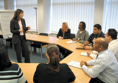 A group of people sitting around a table.