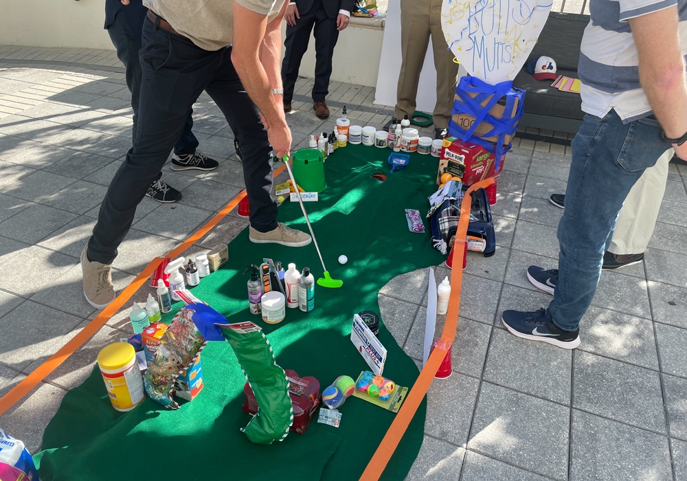A group of people playing a game of golf.
