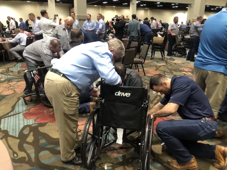 Charities supporting a person in a wheelchair.