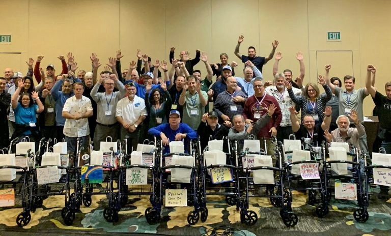 A group of people in wheelchairs posing for a photo.
