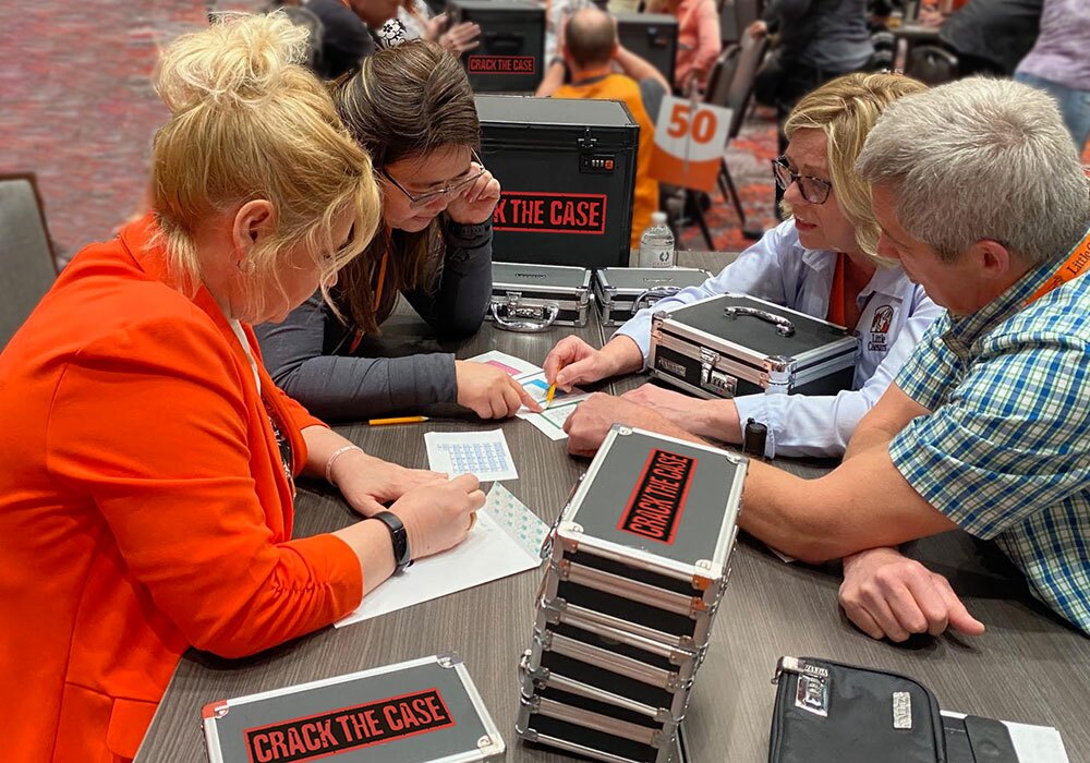 A group of people sitting around a table.
