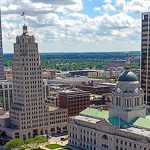 An aerial view of a city with tall buildings.