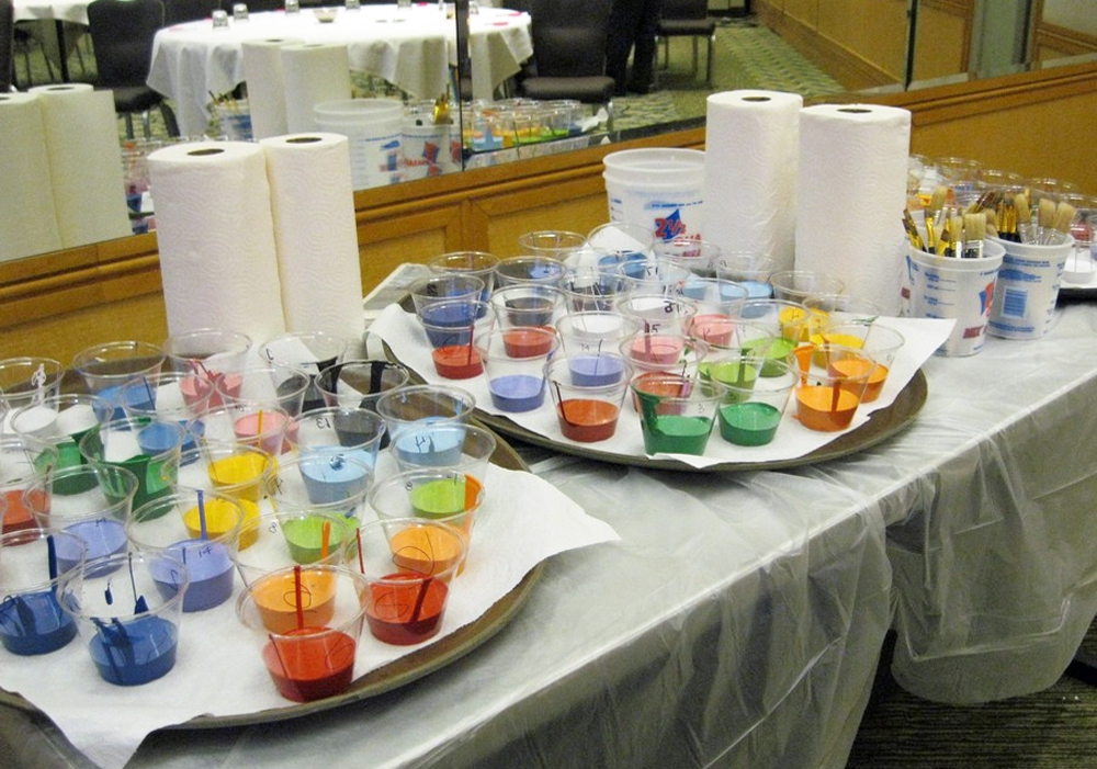A tray of colored cups on a table.