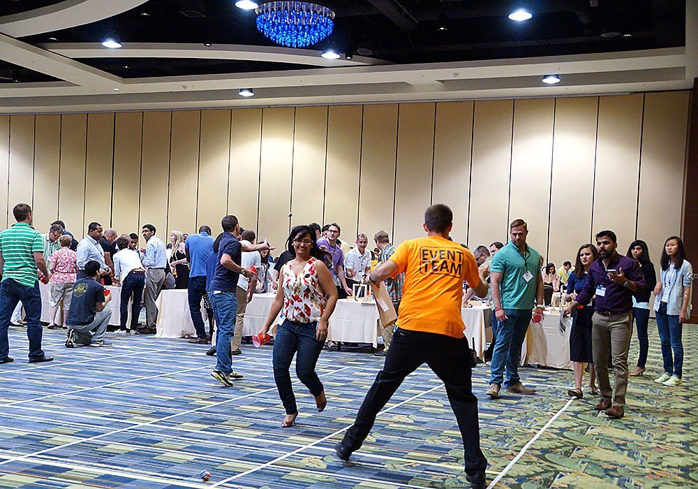 A group of people playing a game of frisbee.