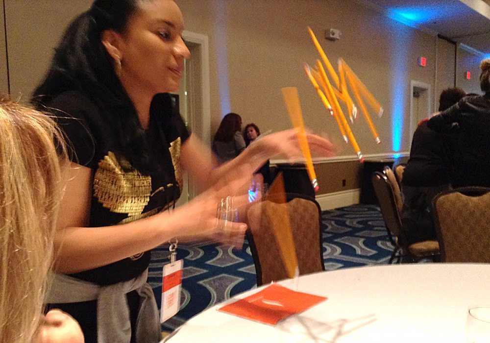 A woman standing at a table.