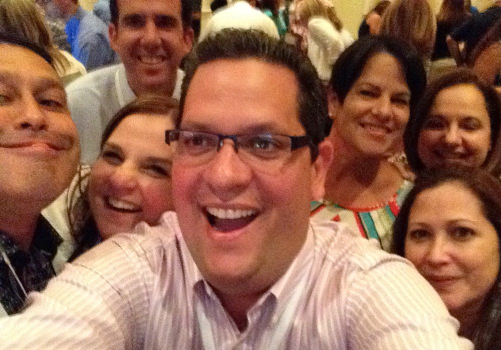 A group of people posing for a selfie.