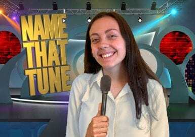 A woman holding a microphone.