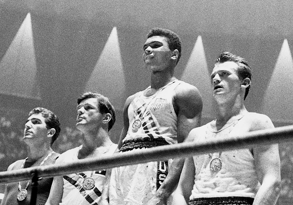 A group of boxers standing in a ring.